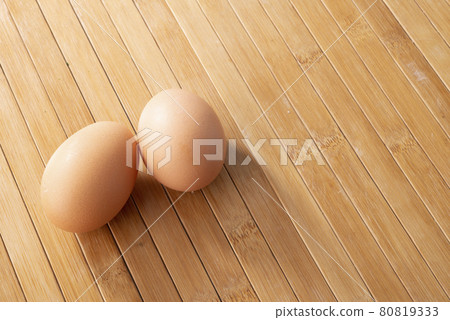 Couple eggs on wooden background Couple eggs on wooden background 80819333