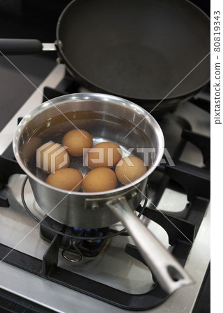 Boiled eggs in pot on the kitchen stove Boiled eggs in pot on the kitchen stove 80819343