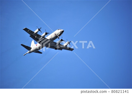 Self-Defense Forces propeller plane going through the deep blue sky 80821141