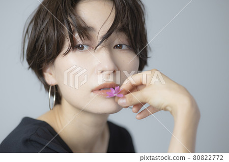 A woman with flowers A woman with flowers 80822772