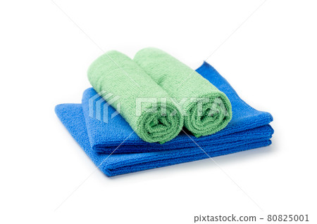 Stack of blue and green towel isolated on white background 80825001