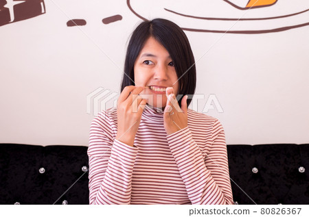 Hands asian woman using toothpick wooden after breakfast Hands asian woman using toothpick wooden after breakfast 80826367