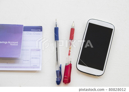 saving account pass book bank and withdrawal slip of bank with mobile phone  80828012