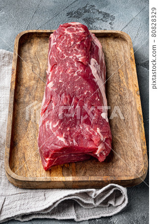 Raw beef filet Mignon steak cut, on gray stone background 80828329