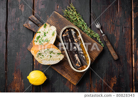 Canned seafood preserved in oil, top view flat lay Canned seafood preserved in oil, top view flat lay 80828343