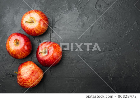 Red apple, on black dark stone table background, top view flat lay, with copy space for text Red apple, on black dark stone table background, top view flat lay, with copy space for text 80828472