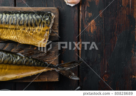 Set of smoked fish, on old dark wooden table background, top view flat lay with copy space for text 80828689