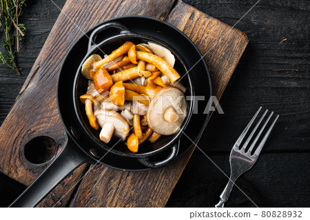 Pickled mushrooms, on black wooden table background, top view flat lay 80828932