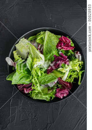 Frieze, romaine and Radicchio lettuce, on black background, top view flat lay Frieze, romaine and Radicchio lettuce, on black background, top view flat lay 80828933