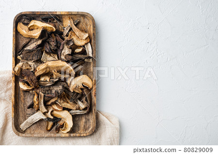 Dried mushrooms, on white background, top view flat lay , with space for text copyspace 80829009