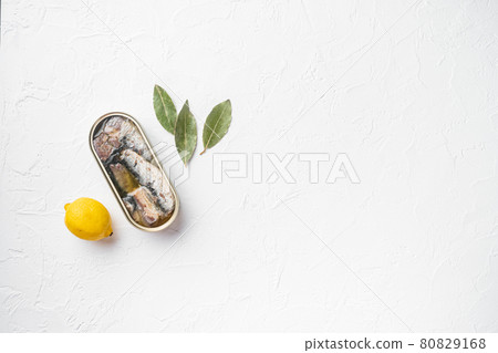 Tin can of seafood sardines fish, on white stone table background, top view flat lay, with copy space for text Tin can of seafood sardines fish, on white stone table background, top view flat lay, with copy space for text 80829168