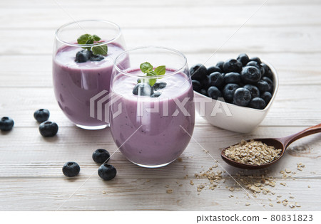 Glasses of blueberry yogurt with blueberries 80831823