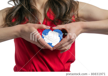 Love Antarctica. The woman holds a heart in the form of the flag of Antarctica on her chest. Concept of patriotism Love Antarctica. The woman holds a heart in the form of the flag of Antarctica on her chest. Concept of patriotism 80831971