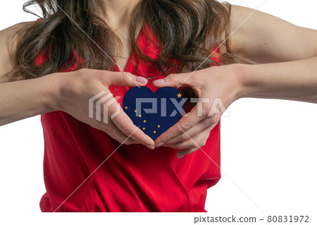 Love Alaska. The woman holds a heart in the form of the flag of Alaska on her chest. Concept of patriotism Love Alaska. The woman holds a heart in the form of the flag of Alaska on her chest. Concept of patriotism 80831972