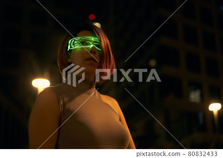 Cyberpunk style portrait of beautiful young woman in futuristic costume. Cyberpunk style portrait of beautiful young woman in futuristic costume. 80832433