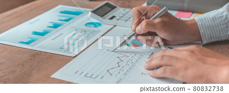 Asian businessmen are analyzing graphs, Financial statistics and calculating corporate returns in private offices, Market research reports and income statistics, Financial and Accounting concept. 80832738