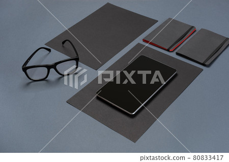 Modern mock up flat lay of notebook and stationery on gray background. Modern mock up flat lay of notebook and stationery on gray background. 80833417