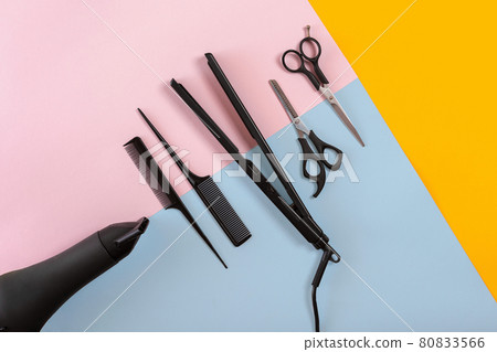 Hairdresser tools on a colored background with copy space 80833566