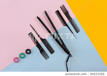 Hairdresser tools on a colored background with copy space 80833568