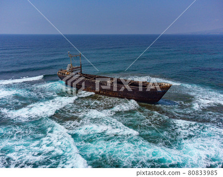 Aerial drone shot of cargo shipwreck in Paphos with waves Cyprus island storm Mediterranean sea Aerial drone shot of cargo shipwreck in Paphos with waves Cyprus island storm Mediterranean sea 80833985