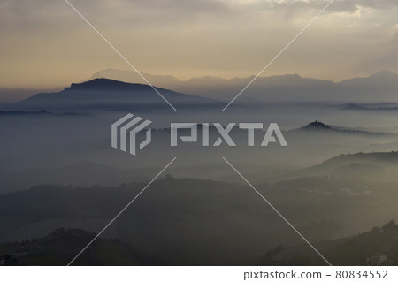 Mist over the hills in the province of Ascoli Piceno in Italy in the morning Mist over the hills in the province of Ascoli Piceno in Italy in the morning 80834552