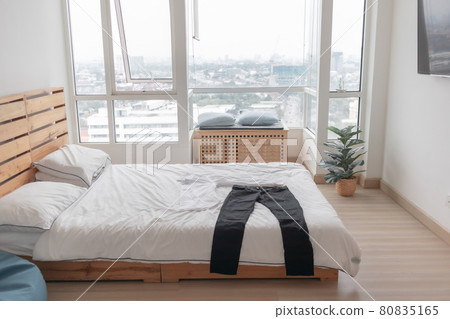 Clothes lying on the bed in the bedroom in concept of preparation. Clothes lying on the bed in the bedroom in concept of preparation. 80835165