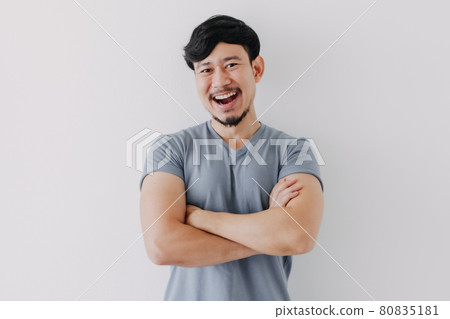Confident and happy man in blue t-shirt isolated on white background. Confident and happy man in blue t-shirt isolated on white background. 80835181