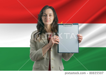Study in Kurdistan. Beautiful woman holding a sheet of paper in her hands. Girl on the background of the flag of Kurdistan Study in Kurdistan. Beautiful woman holding a sheet of paper in her hands. Girl on the background of the flag of Kurdistan 80835507
