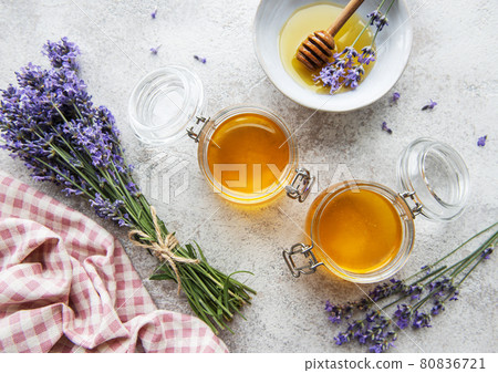 Jars with honey and fresh lavender flowers Jars with honey and fresh lavender flowers 80836721