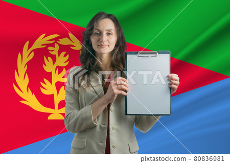 Study in Eritrea Beautiful woman holding a sheet of paper in her hands. Girl on the background of the flag of Eritrea Study in Eritrea Beautiful woman holding a sheet of paper in her hands. Girl on the background of the flag of Eritrea 80836981