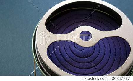 A close-up photo of a mosquito coil in a can case A close-up photo of a mosquito coil in a can case 80837737