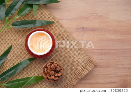 herbal cream cosmetic in a container on table, herbal cream cosmetic in a container on table, 80839223