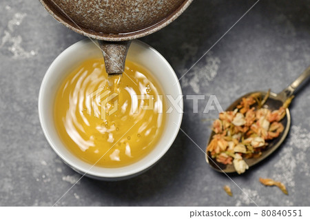 Cup Of Jasmine Tea With Dried Flowers 80840551
