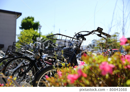 bicycles park on the sidewalk in nature sun light, Japan. bicycles park on the sidewalk in nature sun light, Japan. 80841088