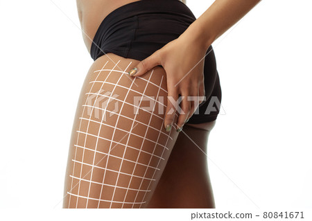 Close-up beautiful female body with lifting up arrows isolated on white background. Collage. Resilient skin, fitness body, anti cellulite procedures. 80841671
