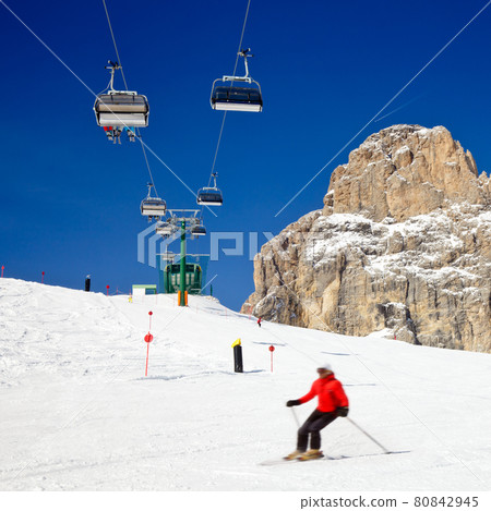 Skiers on a piste Skiers on a piste 80842945