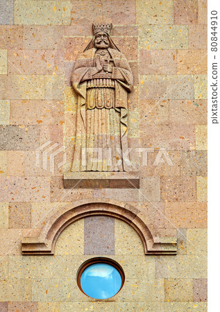 Stone carving. Religious ornament with figure of saint 80844910