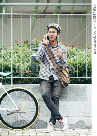 Man Standing at College Fence 80844950