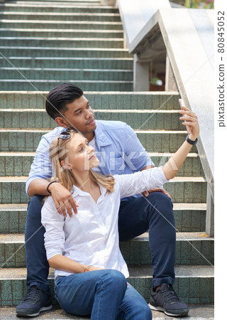 Woman Taking Selfie with Boyfriend Woman Taking Selfie with Boyfriend 80845052