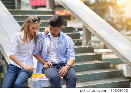 Hungry Multi-ethnic Young Couple 80845058