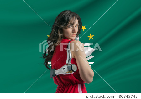 Beauty industry in Macau. Happy female hairdresser holding hairdryer against Macau flag background Beauty industry in Macau. Happy female hairdresser holding hairdryer against Macau flag background 80845743