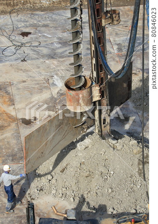 Dismantling work site Workers and augers during piling work Dismantling work site Workers and augers during piling work 80846023