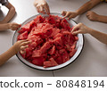 Children hold pieces of watermelon. Selective focus. Top view 80848194