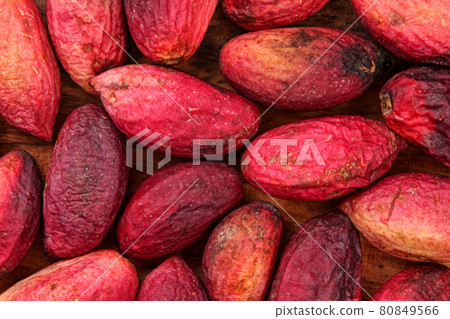 Top view closeup of raw turkish red pistachios, skin wrinkled after couple of days. Nuts and green seeds are under. Top view closeup of raw turkish red pistachios, skin wrinkled after couple of days. Nuts and green seeds are under. 80849566