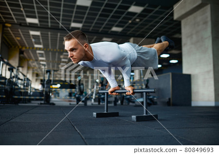 Man doing abs exercise, fitness training in gym Man doing abs exercise, fitness training in gym 80849693