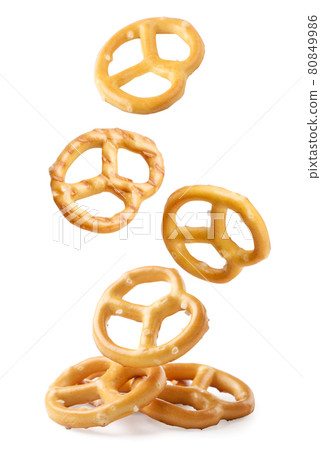 A pretzel falling on a white background, a pretzel levitating. Isolated A pretzel falling on a white background, a pretzel levitating. Isolated 80849986