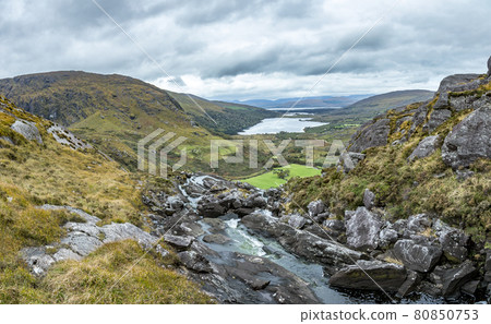 Typical Irish landscape with green meadows and rough mountains during daytime 80850753