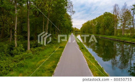 Beautiful view of Dessel-Schoten canal in Belgium. Pathway or Footpath along the water. Path passing Beautiful view of Dessel-Schoten canal in Belgium. Pathway or Footpath along the water. Path passing 80850755