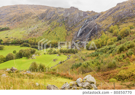 Typical Irish landscape with green meadows and rough mountains during daytime 80850770