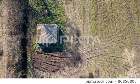 Aerial view from a drone of a brutalist cold gritty concrete world war two, ww2, pillbox war bunker Aerial view from a drone of a brutalist cold gritty concrete world war two, ww2, pillbox war bunker 80850803